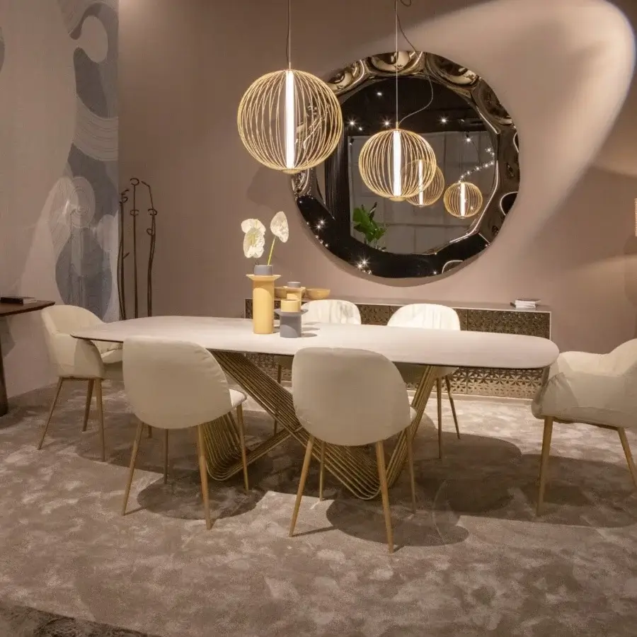 Elegant Tonin Casa Tenso table with travertino tabletop and intricately woven gold-toned painted steel base