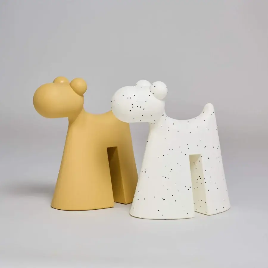 Superior Serralunga Doggy sculpture crafted in mustard yellow LLDPE with a smooth matte texture