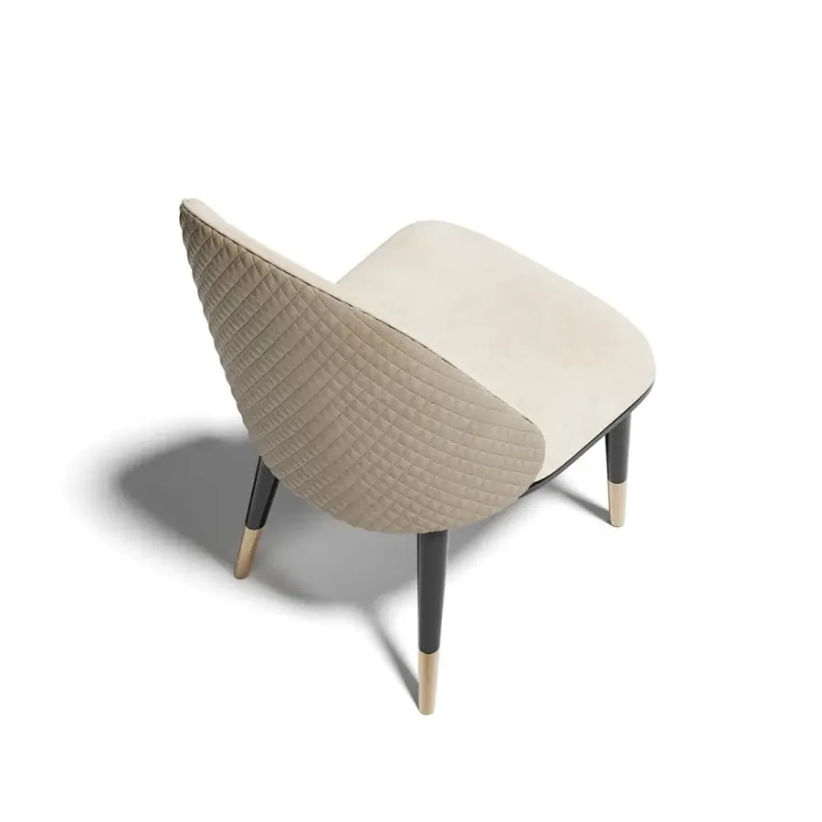 Distinguished Capital Diva chair upholstered in neutral beige quilted textile with gold-capped metal feet and solid wooden frame