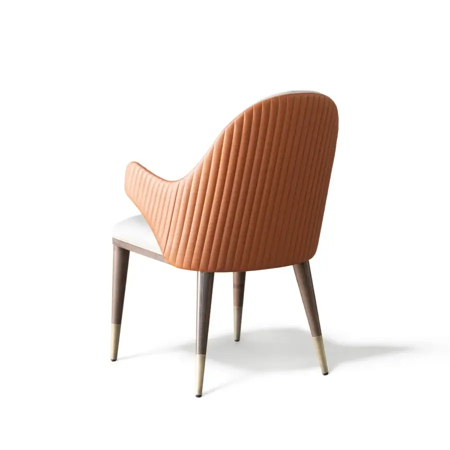 Distinguished Capital Diva chair built with reddish-brown pleated upholstery, a satin wooden frame and sleek metal feet