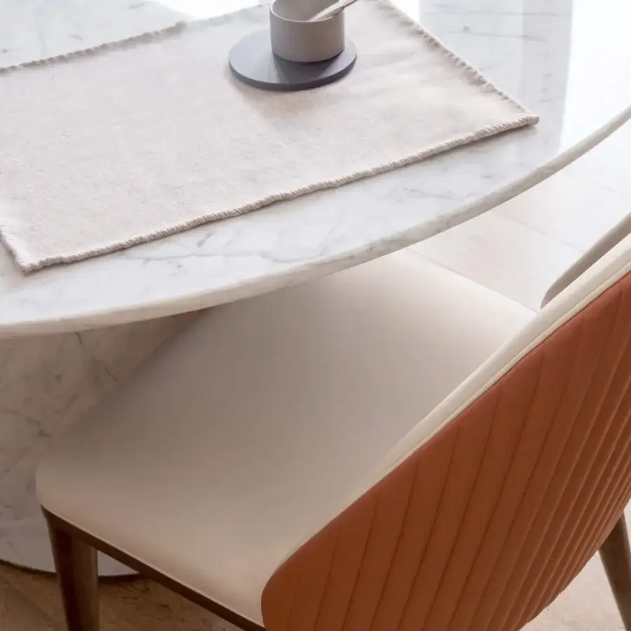 Distinguished Capital Diva chair with white molded shell and reddish-orange ribbed textile upholstery built upon a solid wooden frame