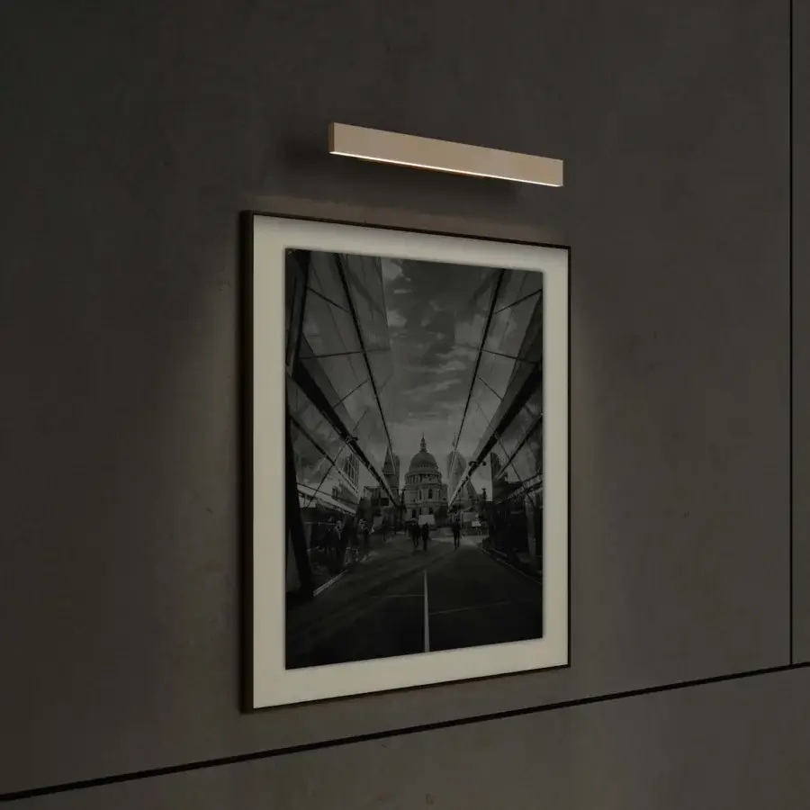 Refined Contardi Fly Picture lamp with sleek metal body and satin finish gently illuminates artwork in a white aesthetic