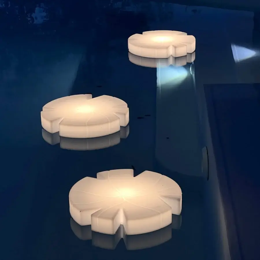 Elegant Serralunga Fiore Di Loto floating table crafted with durable recyclable LLDPE in an opaline finish for outdoor spaces