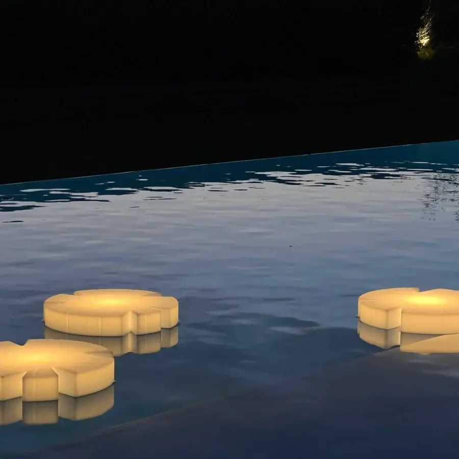 Captivating Serralunga Fiore Di Loto floating table with organic shape crafted from opaline LLDPE and integrated neutral LED lighting
