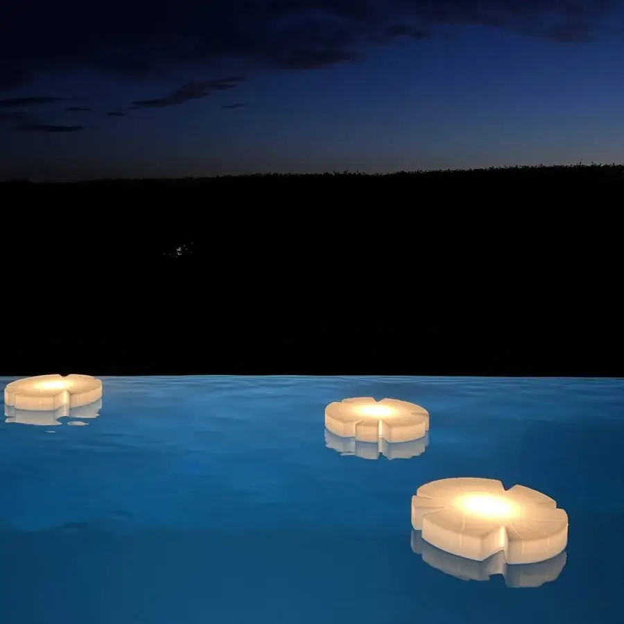 Distinguished Serralunga Fiore Di Loto floating table crafted from LLDPE with opaline finish and integrated ambient lighting
