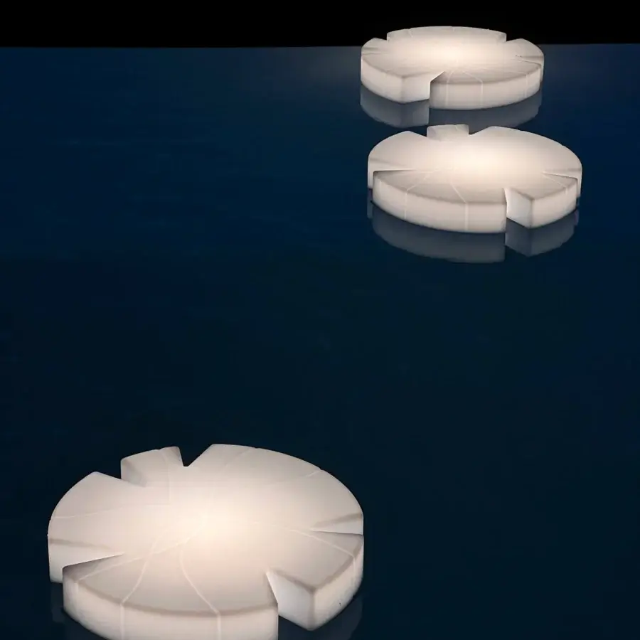 Superior Serralunga Fiore Di Loto floating table in pale off-white LLDPE with an opaline finish embodies graceful contemporary form