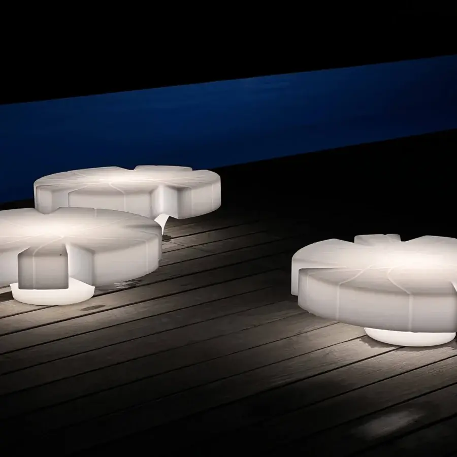 Exclusive Serralunga Fiore Di Loto floating table crafted from LLDPE in pale off-white with opaline finish and integrated wireless LED light system