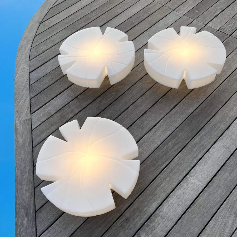 Captivating Serralunga Fiore Di Loto floating table crafted with opaline white LLDPE and smooth matte finish