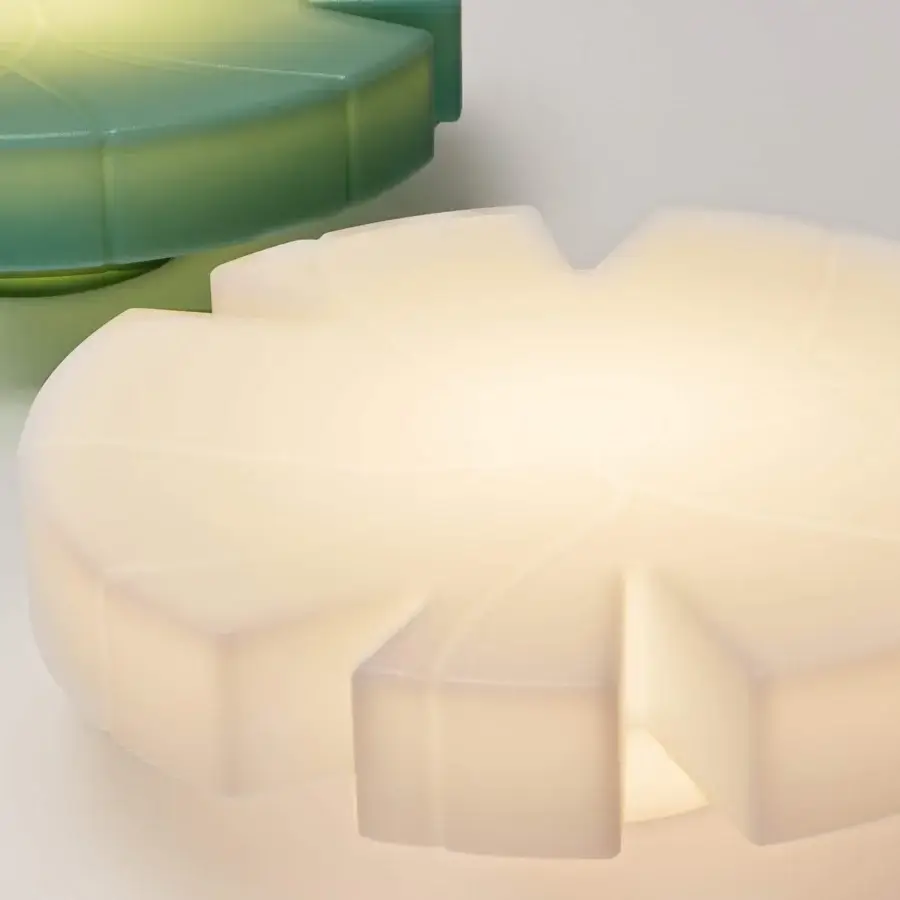 Distinguished Serralunga Fiore Di Loto floating table sculpted from recyclable opaline LLDPE with integrated neutral LED light system