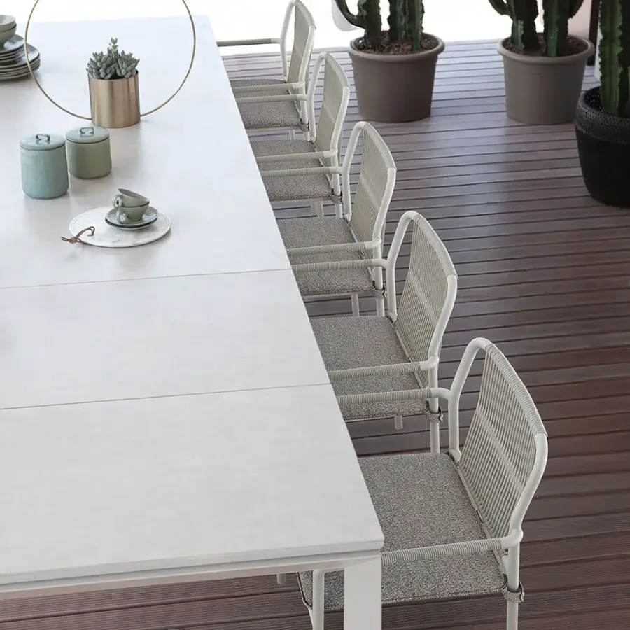 Elegant Atmosphera Air armchair with a solid white aluminum frame and hand-woven sage green seat