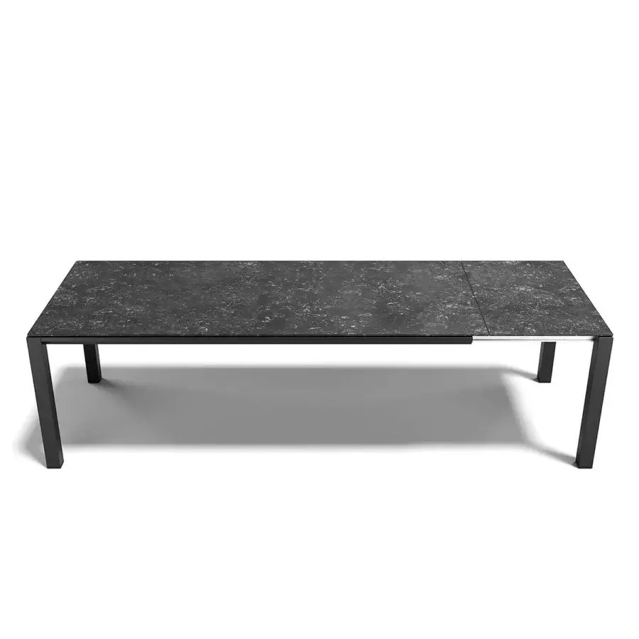 Distinguished Atmosphera Bridge extendable table with a dark gray stoneware top and matte aluminum base crafted with enduring stability