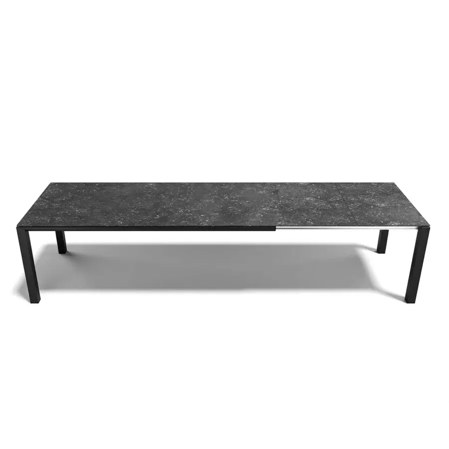 Exceptional Atmosphera Bridge extendable table with a stoneware top and robust aluminum base in matte black and dark gray finish