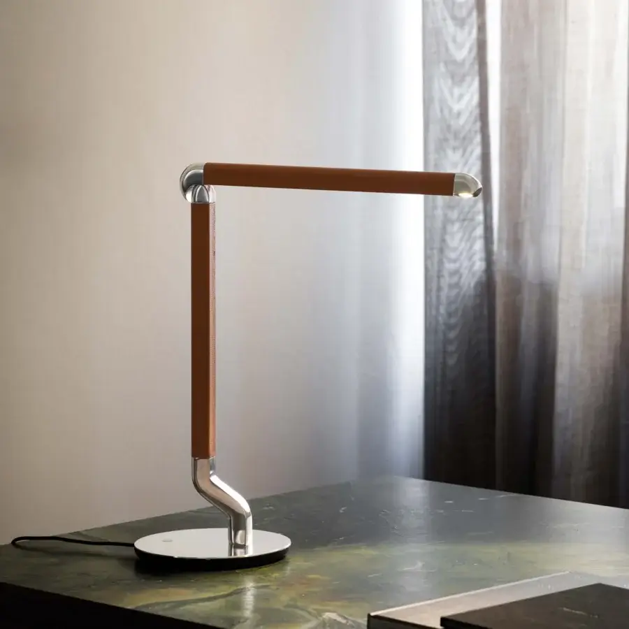 Distinguished Contardi Picchio lamp with a sleek silver metal frame and warm brown textile covered arm