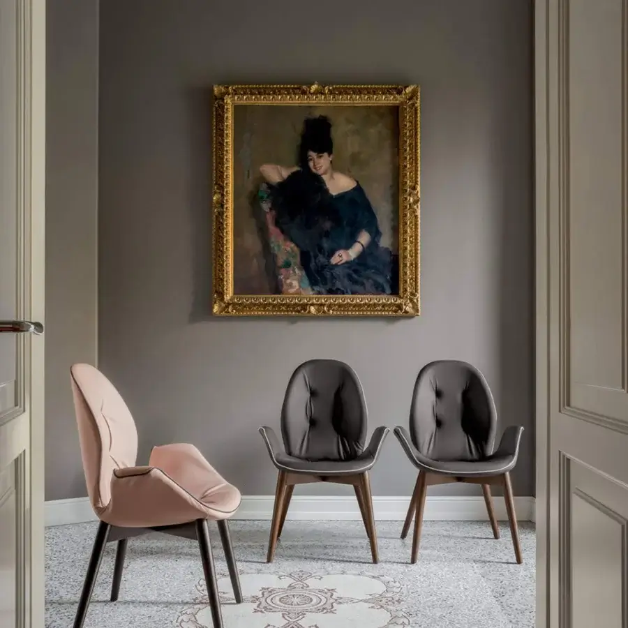 Sophisticated Tonin Casa Sorrento armchair with pale pink textile upholstery and satin-finish medium-tone brown ash wood frame