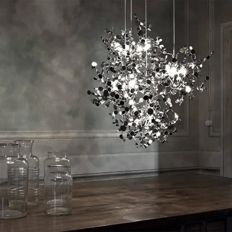 Luxury Terzani Argent suspension lamp crafted in polished reflective silver with hand-assembled metal discs creating a captivating glow