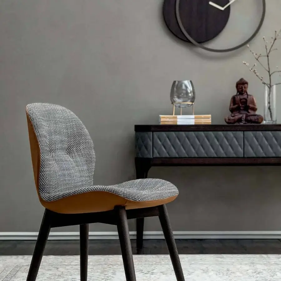 Distinctive Tonin Casa Sorrento Ésprit chair with textured gray textile and tan leather-like upholstery with satin-finish wood legs