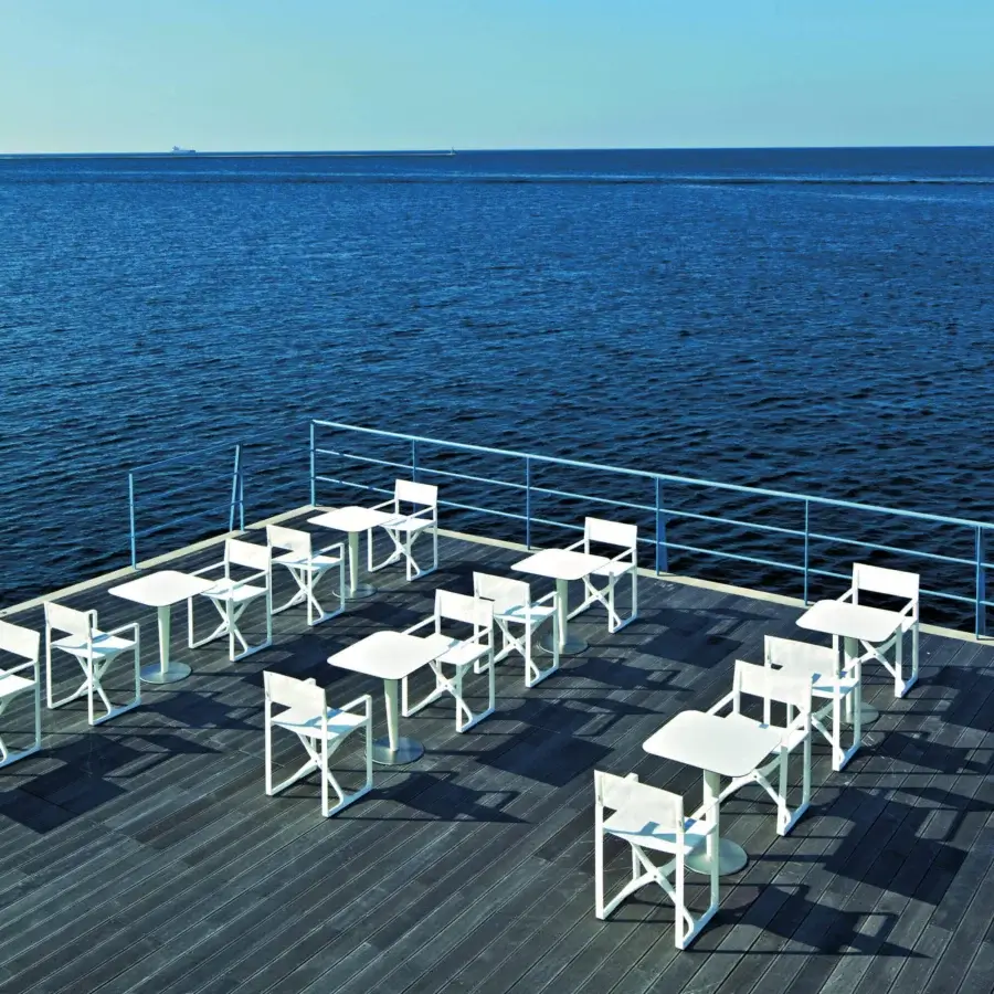 Elegant Serralunga Regista armchair crafted in white polyamide with Batyline seat and back, exhibiting a smooth finish