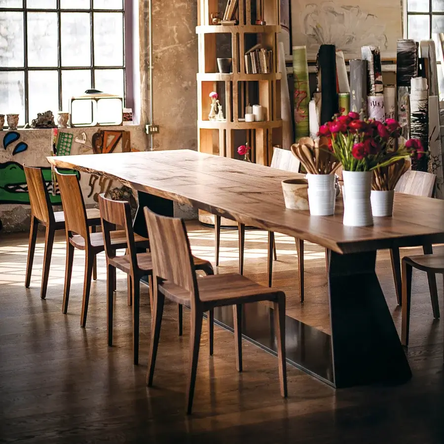 Elegant Riva 1920 Bedrock Plank table built with monumental warm medium-brown solid wood and a satin finish iron base