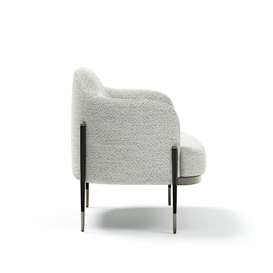 Distinguished Capital Oxford lounge chair with speckled off-white textile, quilted leather backrest and dark metal legs