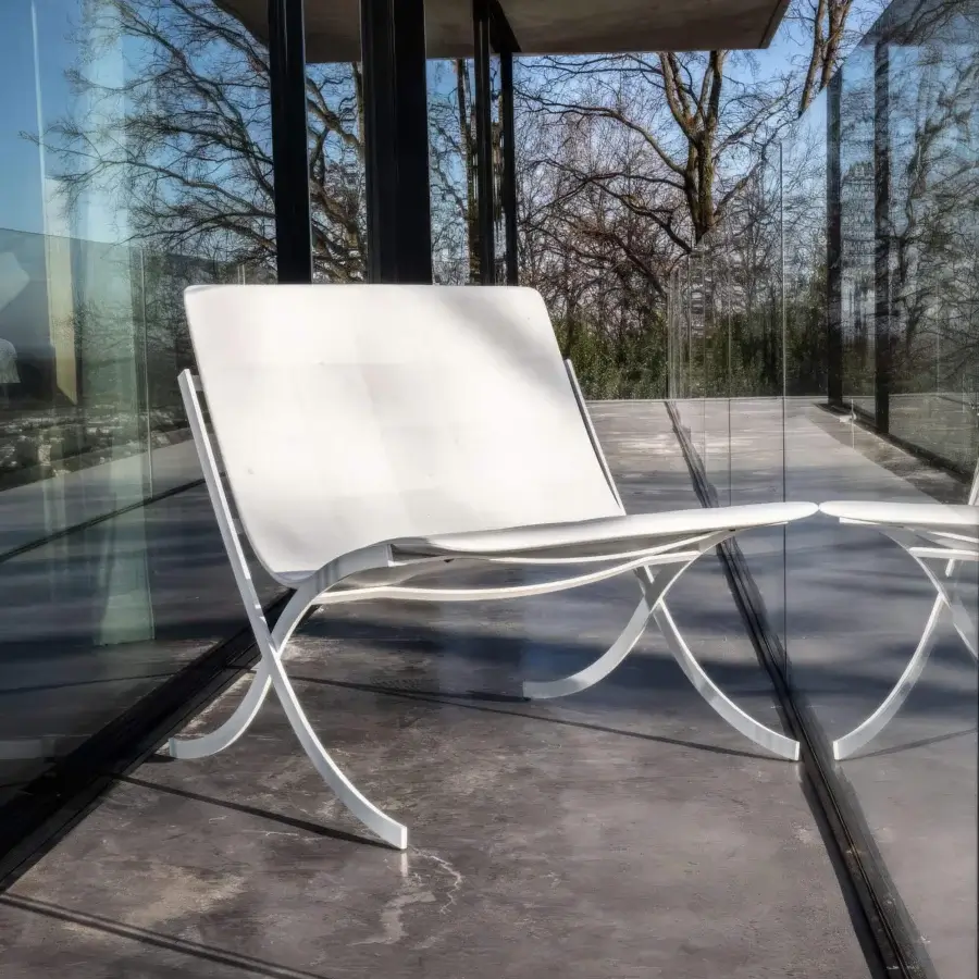 Elegant Serralunga Barceloneta lounge chair crafted with painted AISI 304 stainless steel and molded PU seat in matte white RAL 9016 finish