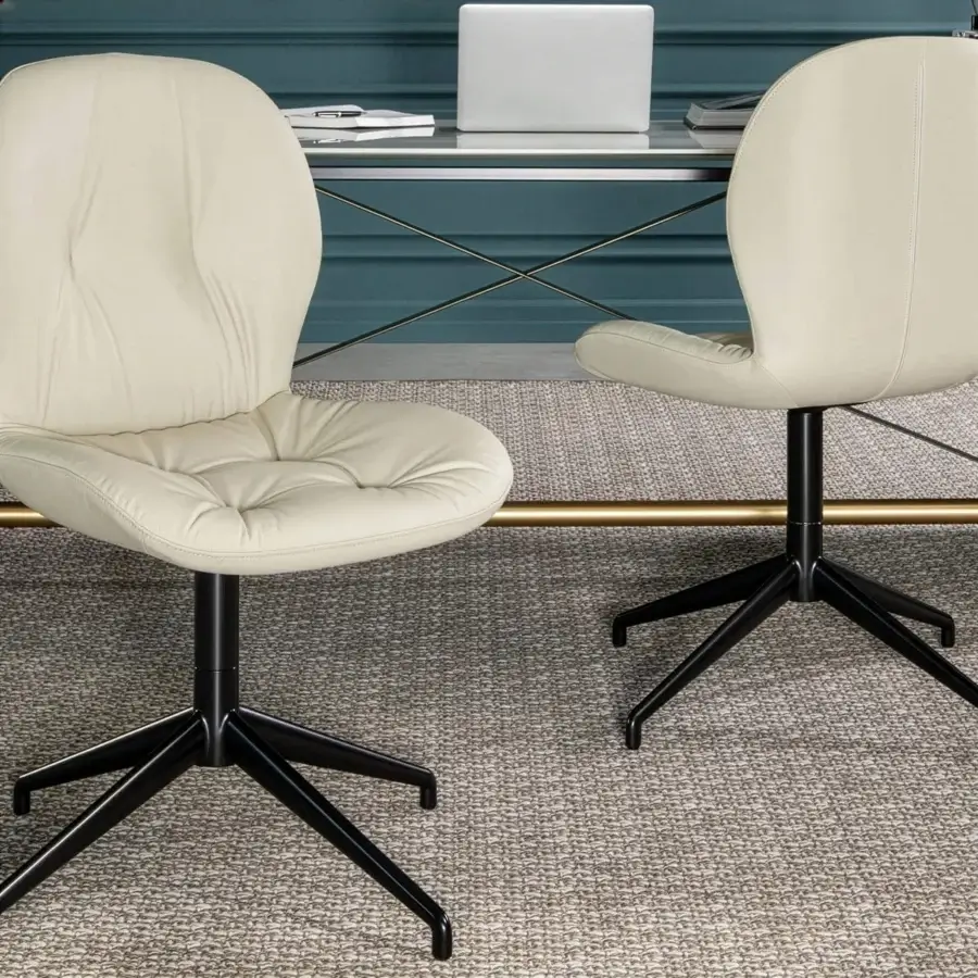 Distinguished Tonin Casa Sorrento Ésprit chair with comfortable silhouette in light beige upholstery and matte black painted aluminum base