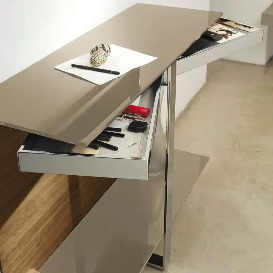 Exclusive Ivano Antonello Italia Manta console with a polished silvery-grey metal frame and rotating tempered glass shelves