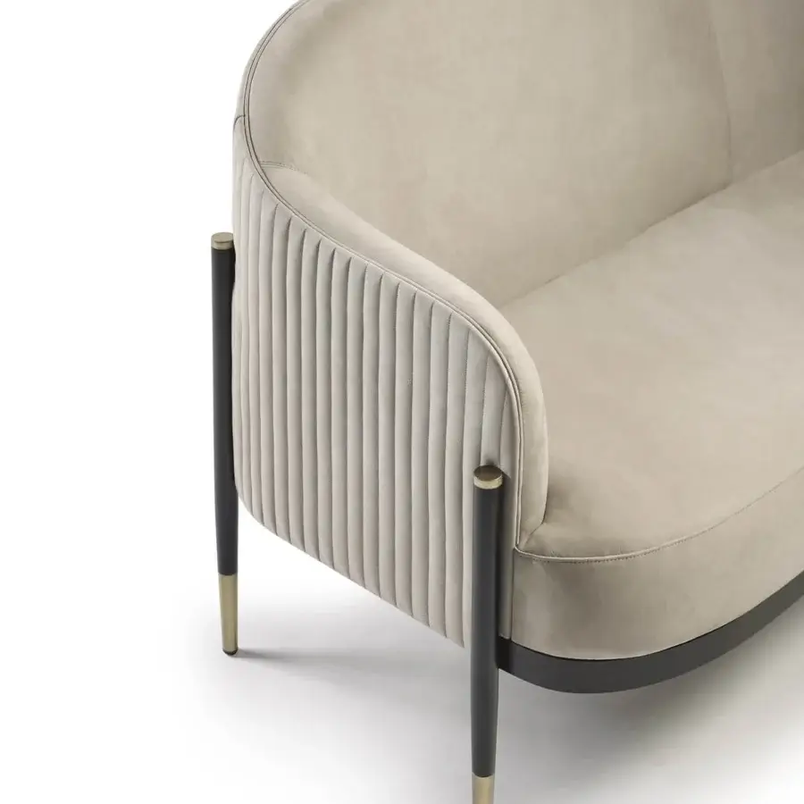 Sophisticated Capital Oxford sofa upholstered in soft beige velvet with quilted leather detailing and sleek metal legs