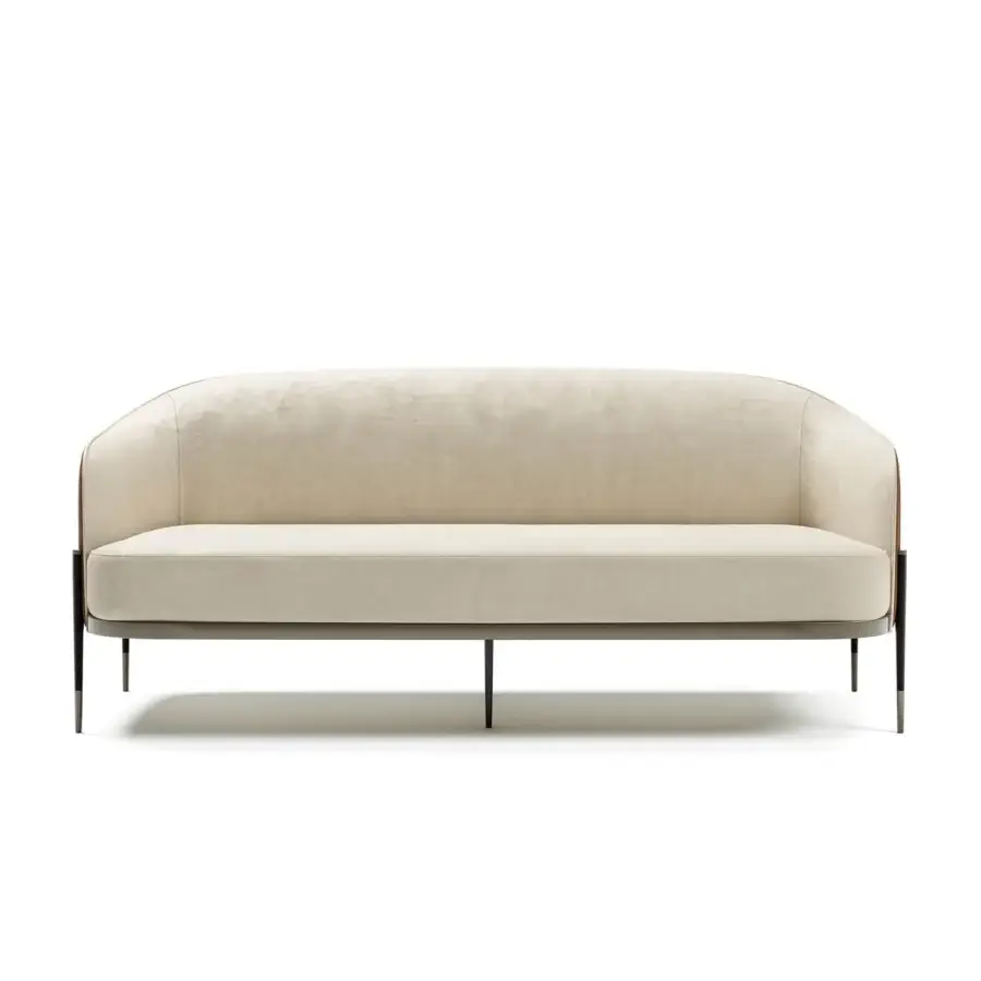 Sophisticated Capital Oxford sofa with light beige textile upholstery and quilted leather outer backrest, built with slender metal legs