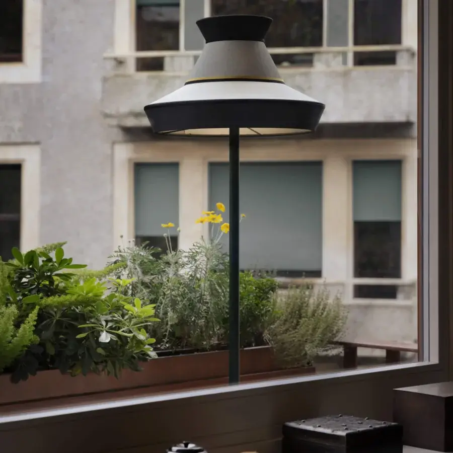 Distinguished Contardi Calypso Outdoor Floor Lamp with a sleek metal stem and premium marble side table in dark gray with gold accents