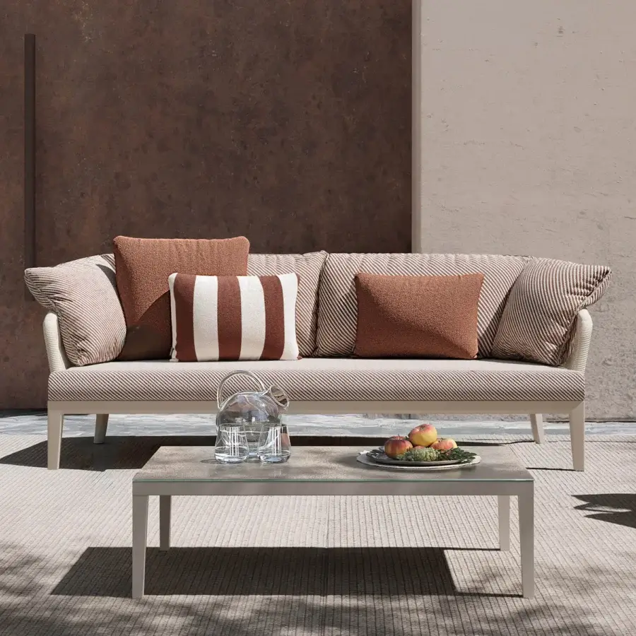 Refined Atmosphera Dream 2.0 sofa with warm beige and tan textured textile upholstery and smooth matte light-colored metal frame detailing