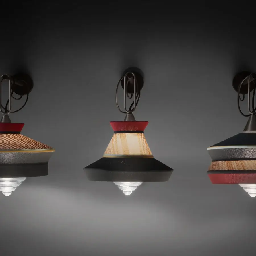 Distinguished Contardi Calypso Wall Lamp lighting crafted with tiered conical shades in red, brown, and black tones with a satin finish