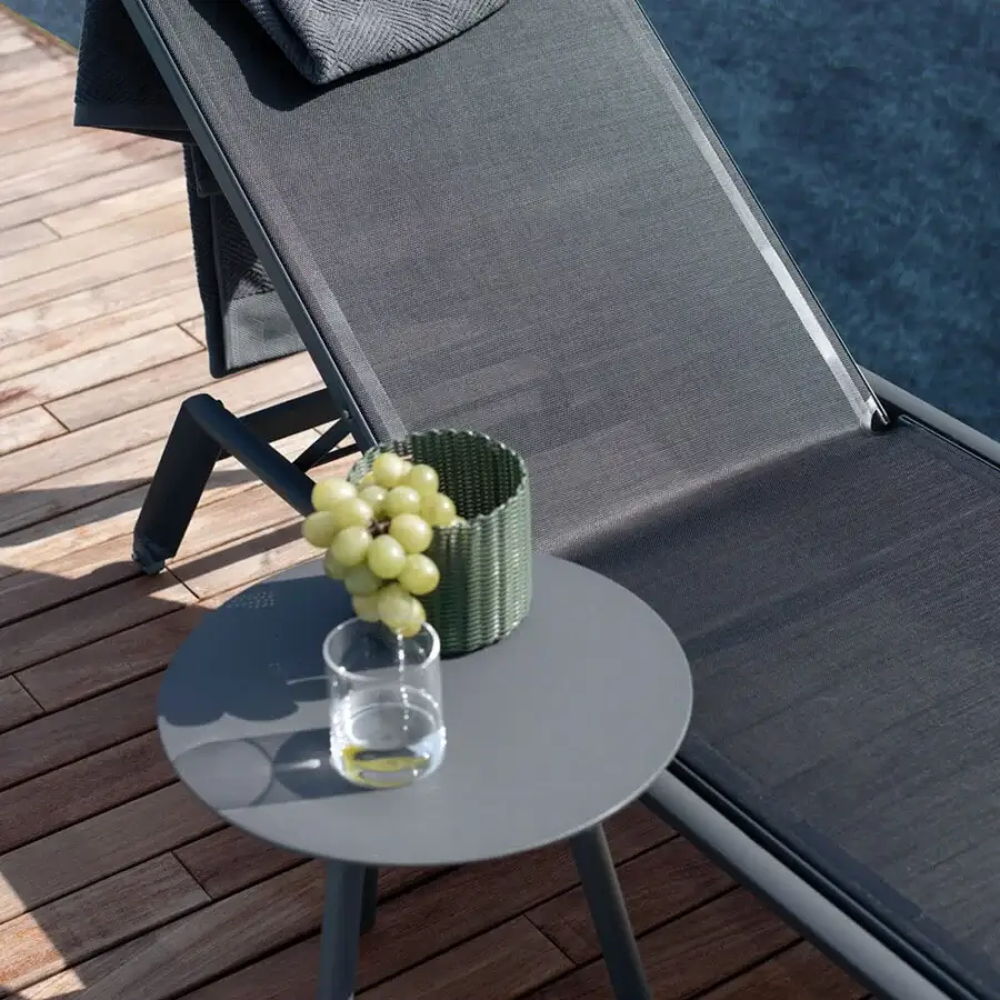 Refined Atmosphera Dream side table with durable aluminum and epoxy painted top in a sleek dark gray finish