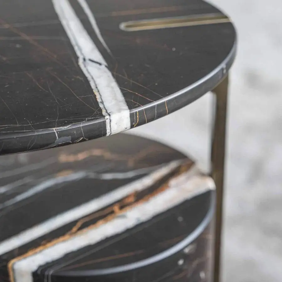 Distinguished Capital Hugo side table with dark marble exhibiting golden undertones and satin metal framing