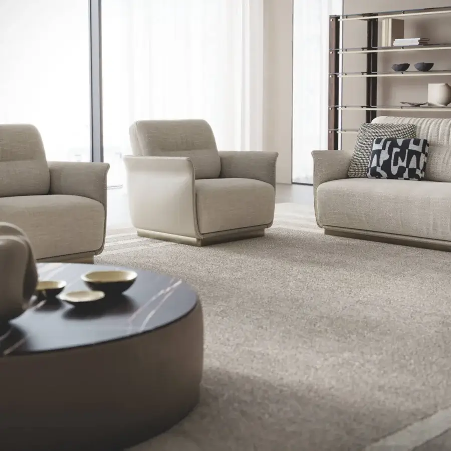 Distinguished Capital Mon Allure lounge chair with foam-molded shell and plain fabric upholstery in dark earthy tones with metal-finished plinth base