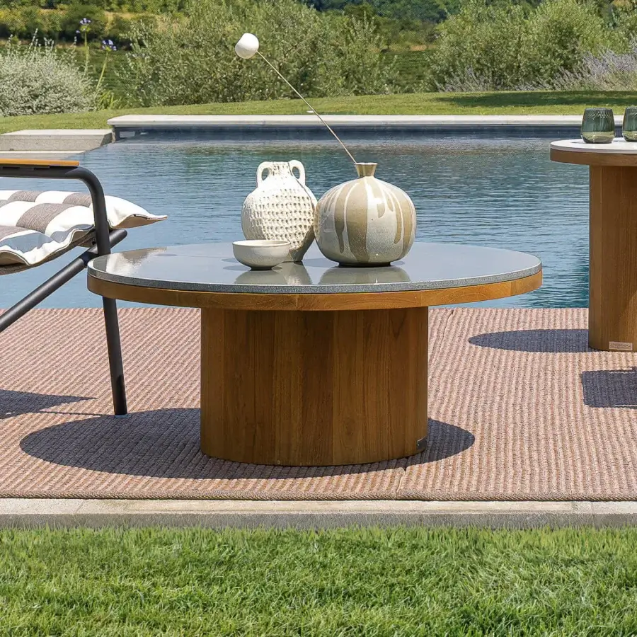 Distinguished Atmosphera Frisbee coffee table with warm teak base and striking Gres tabletop in satin finish