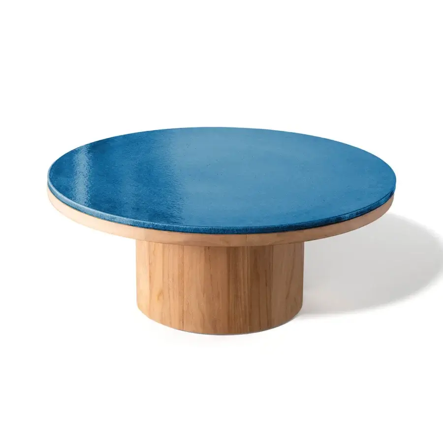 Elegant Atmosphera Frisbee coffee table with a vibrant blue Gres tabletop and refined teak base