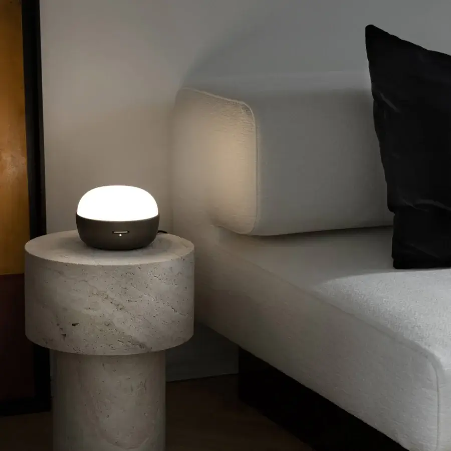Elegant Contardi Kiki table lamp set with white opal glass diffuser and matte white body built with neutral stone pedestal