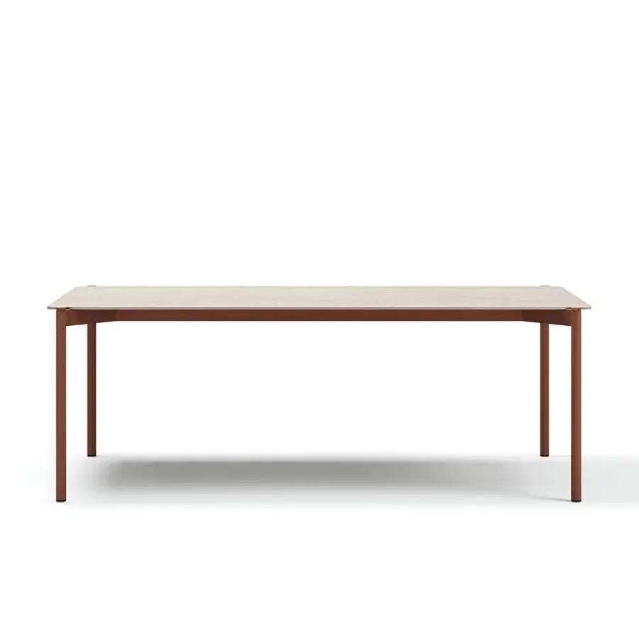 Superior Atmosphera Heritage table with a light beige gres tabletop and cylindrical aluminum legs crafted with teak accents in a satin finish