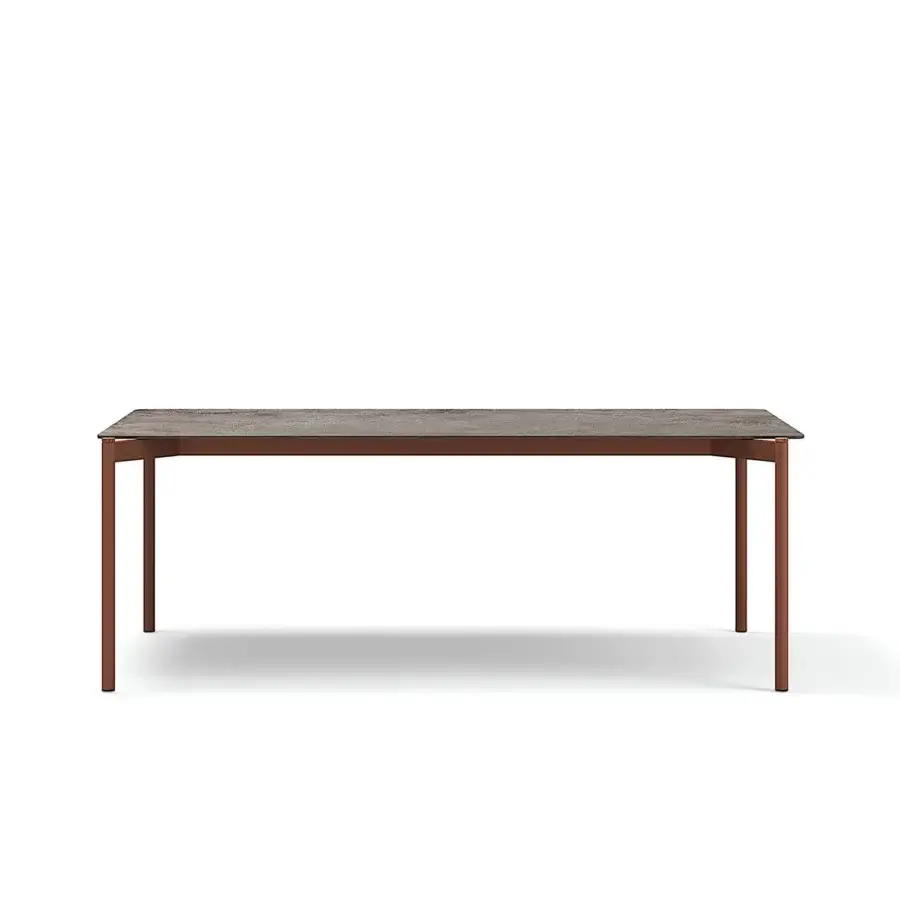 Exceptional Atmosphera Heritage table built with a gres tabletop in earthy browns, grays and reddish tones with sleek aluminum legs and teak accents