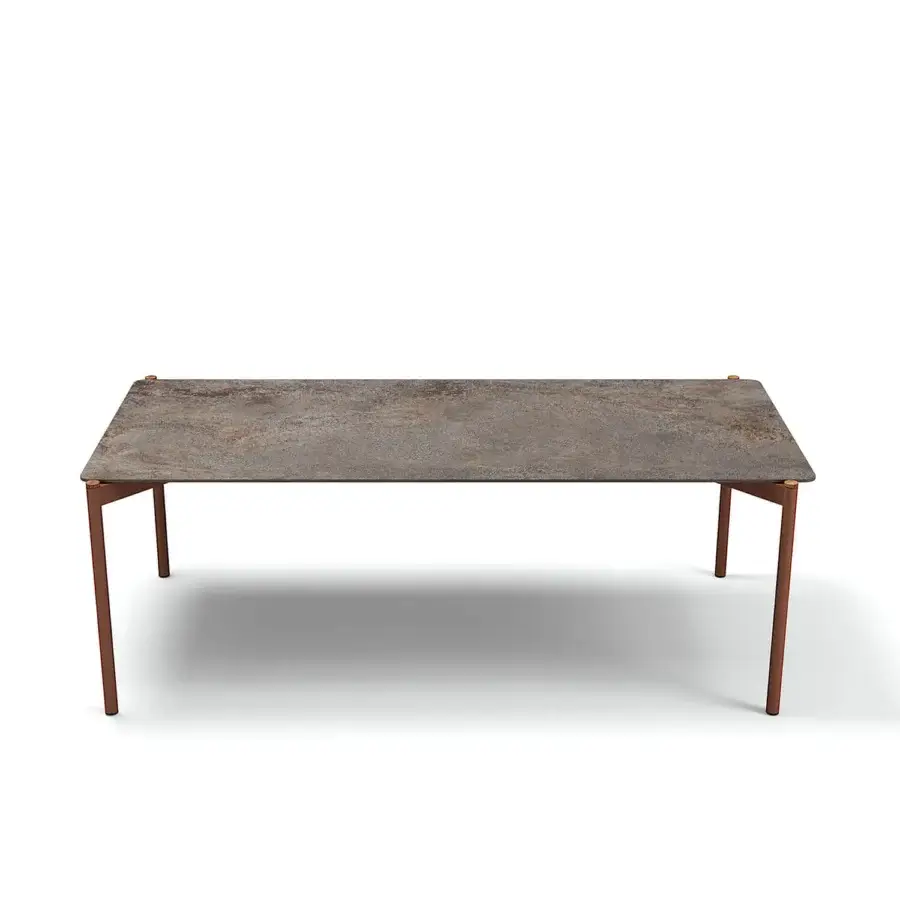 Superior Atmosphera Heritage table built with a gres tabletop in mottled grey, brown and rust with warm teak and aluminum legs