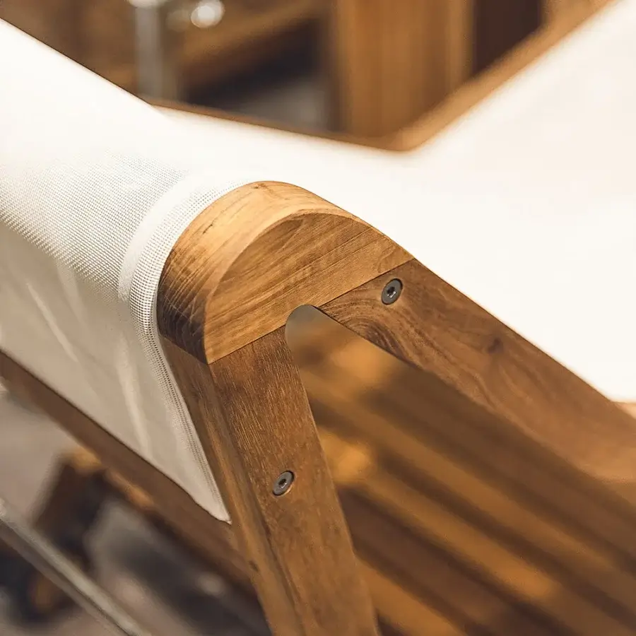 Distinguished Atmosphera Infinity chaise lounge crafted with Asian oiled TEAK wood and breathable white textilene surface