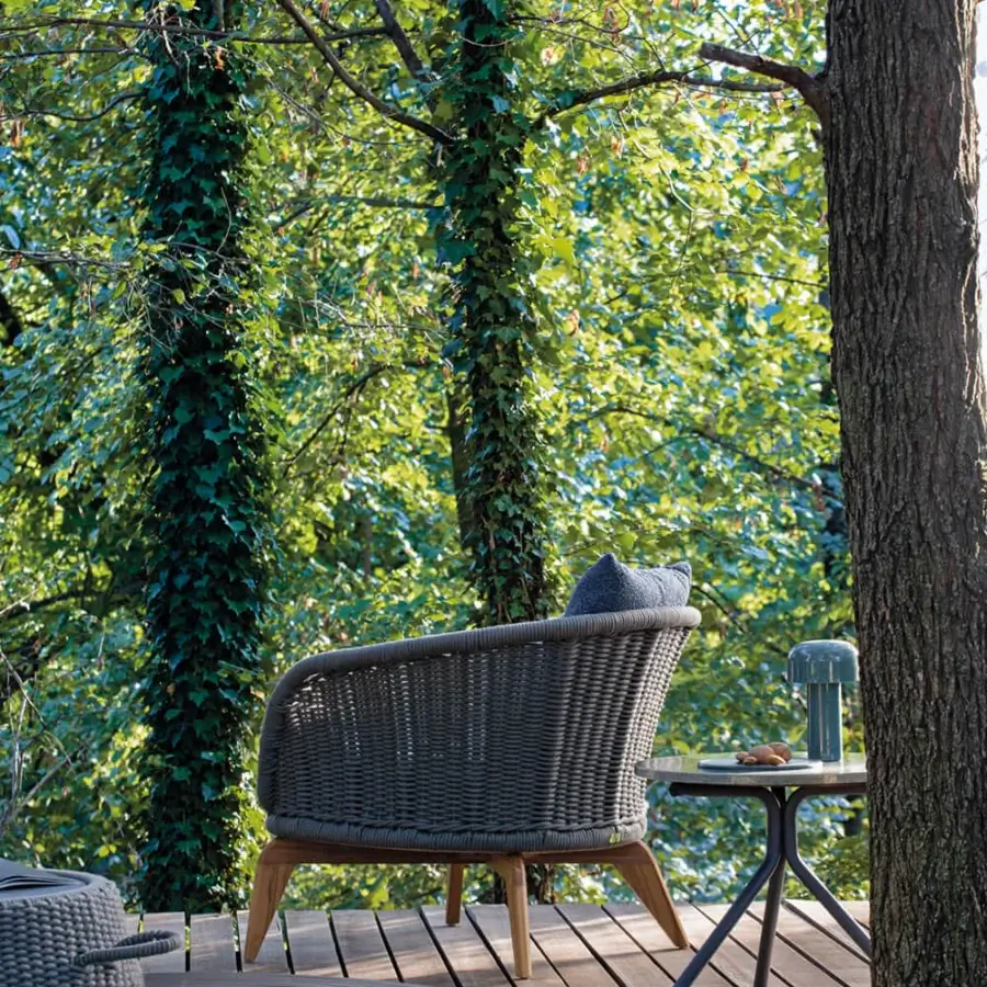 Distinguished Atmosphera Ludo lounge chair with hand-woven rope backrest and natural Teak wood frame in muted gray textiles