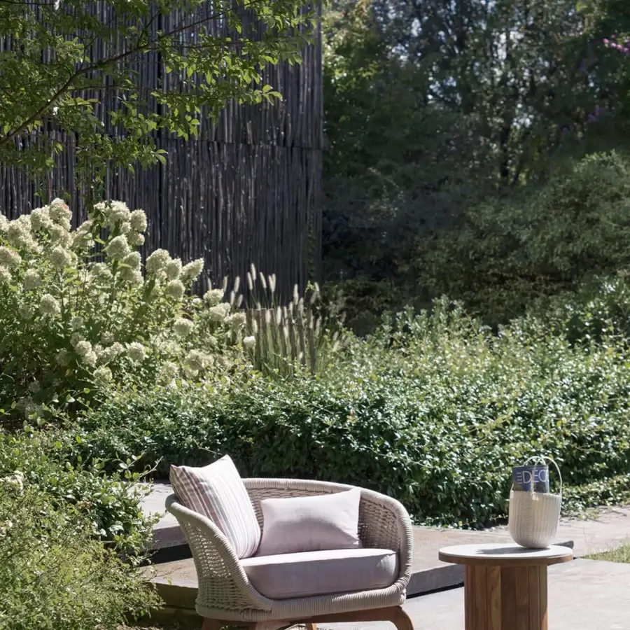 Distinctive Atmosphera Ludo rocking lounge chair with blush pink textile and hand-woven rope backrest crafted in natural Teak wood