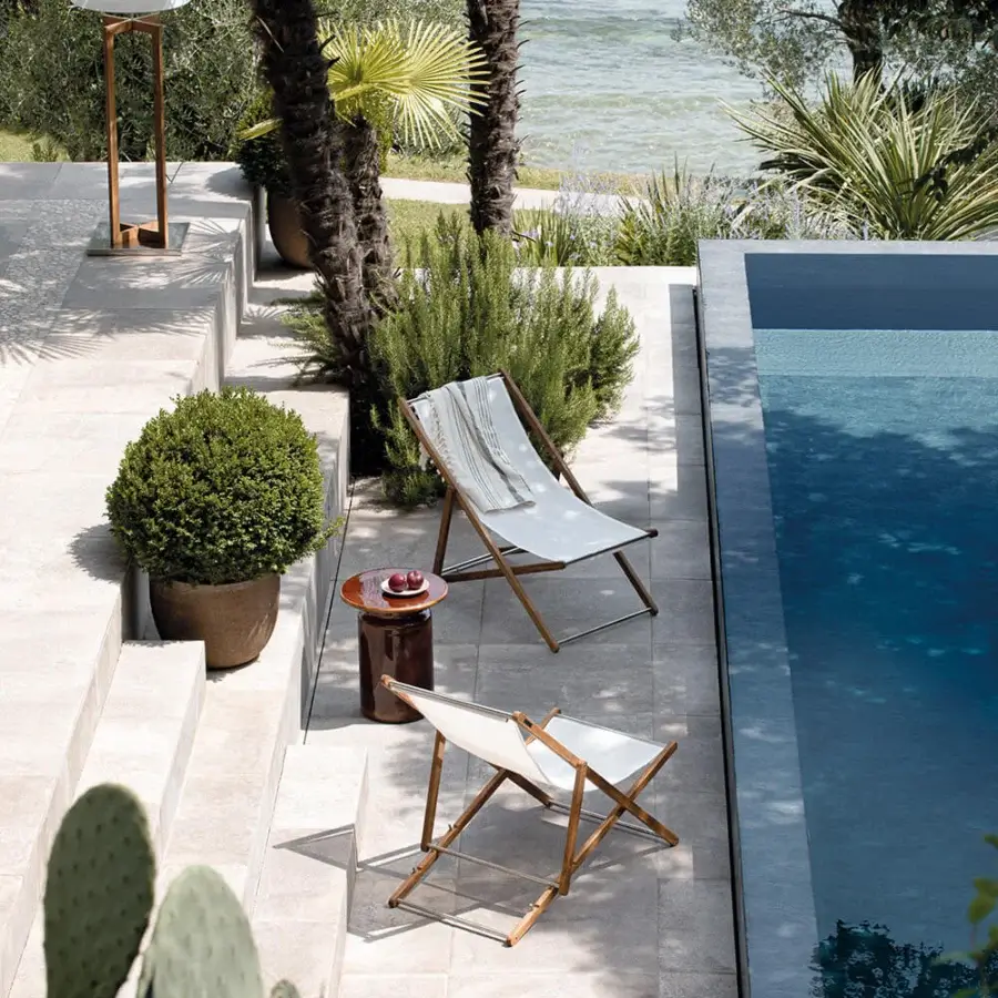 Sophisticated Atmosphera Nirvana deck chair crafted with Asian teak and off-white textilene, finished with a smooth oil treatment