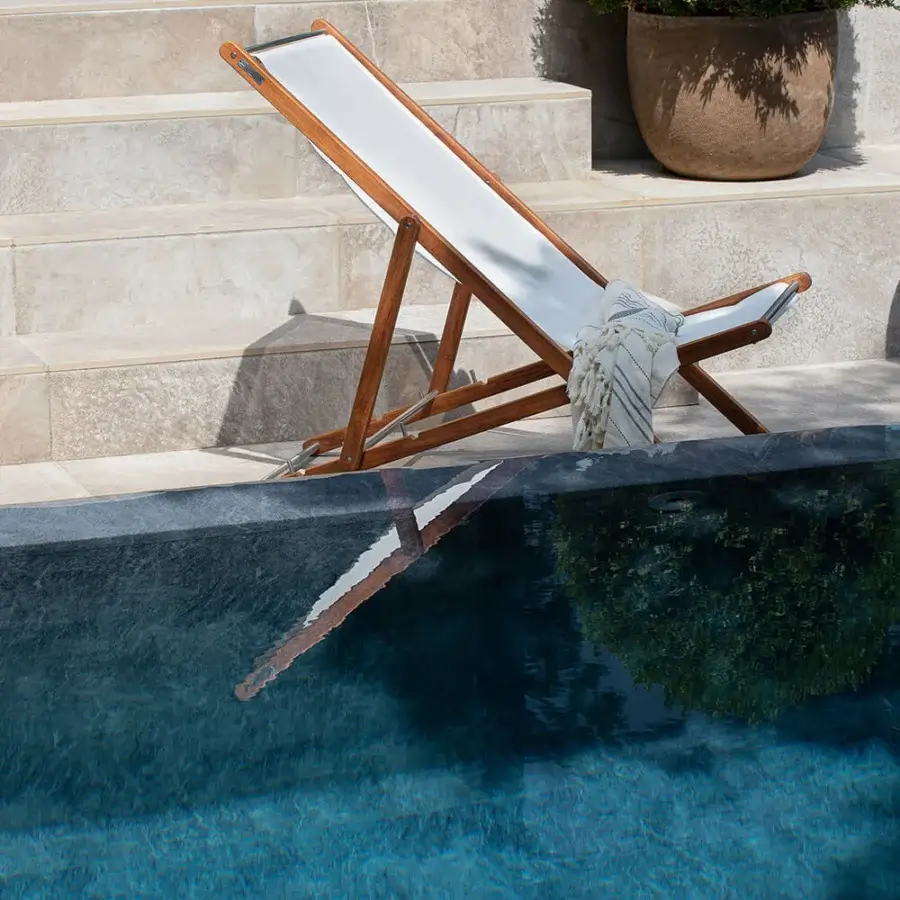 Exceptional Atmosphera Nirvana deck chair with Asian teak frame, white textilene upholstery and brushed steel accents built with an oil finish