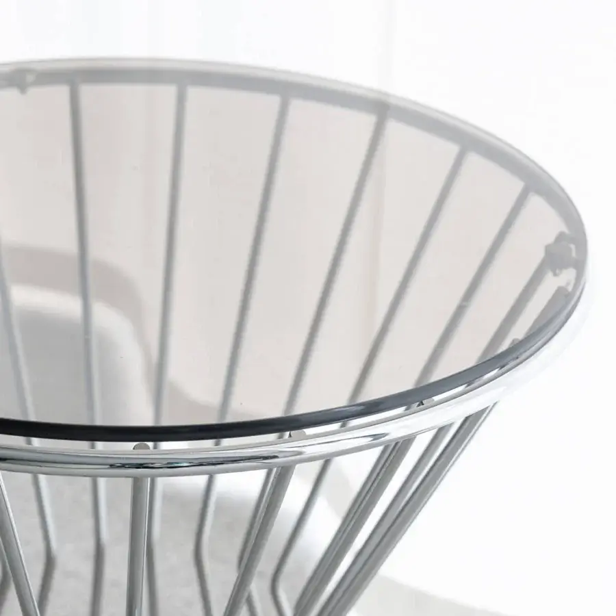 Captivating Capital Khero side table with round glass top and interwoven metallic cylinders in polished silver finish