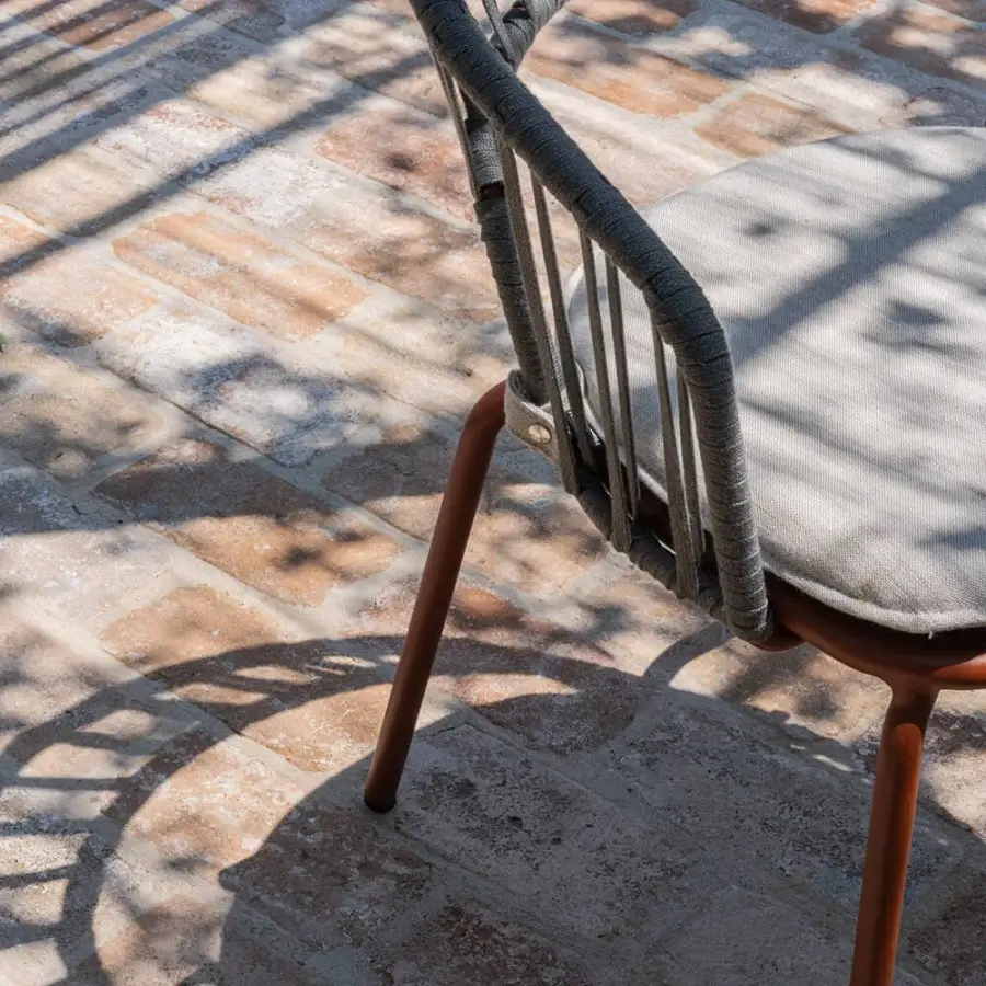 Distinctive Atmosphera Onda armchair with braided backrest and curved silhouette crafted in dark gray textile with reddish-brown satin metal frame
