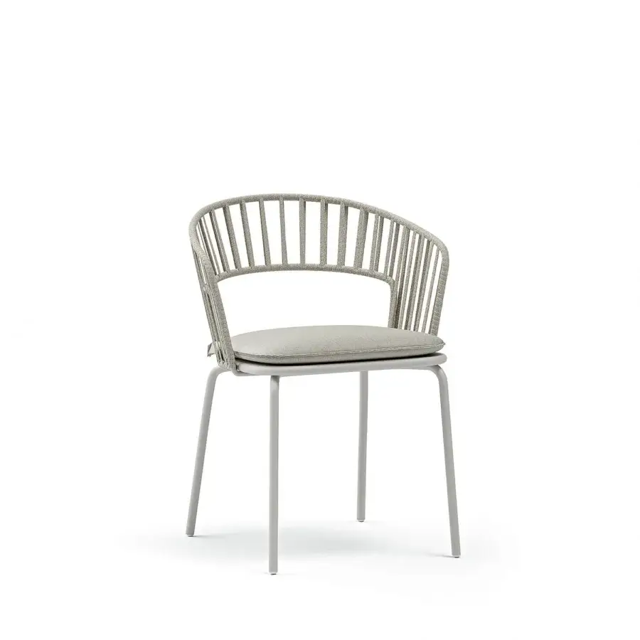Harmonious Atmosphera Onda armchair with gracefully curved form and light gray metal with textured textile upholstery