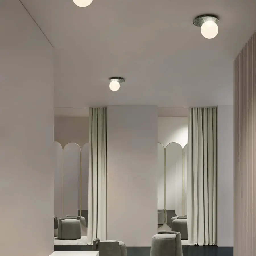 Distinguished Contardi Emma ceiling lamp crafted in marble with a white opal glass sphere diffuser and dark textured base