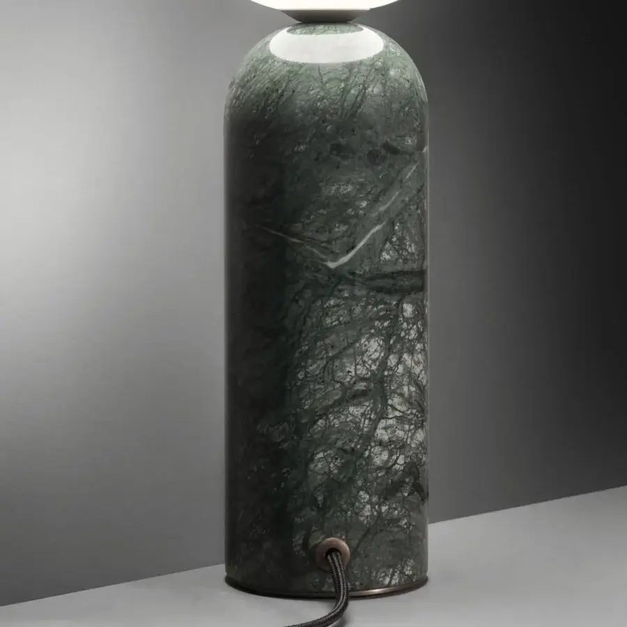 Refined Contardi Emma table lamp crafted in green marble with a white opal glass sphere and muted bronze metallic connector